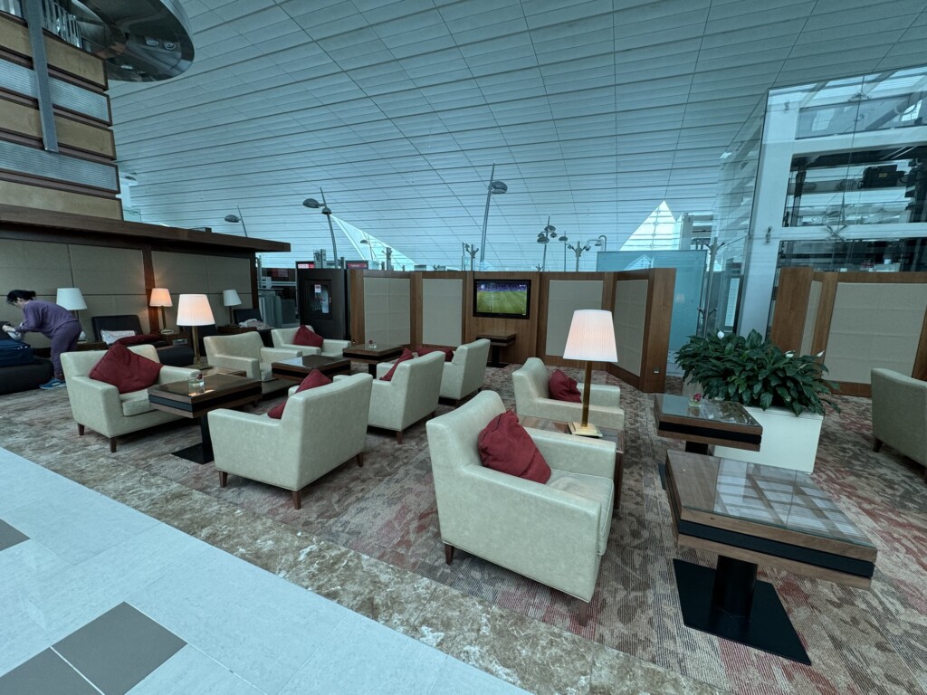 a lounge area with chairs and tables