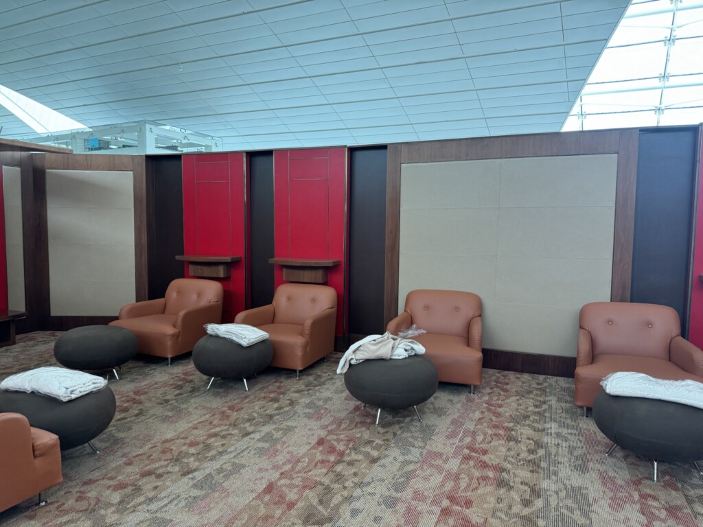 a room with chairs and a wall