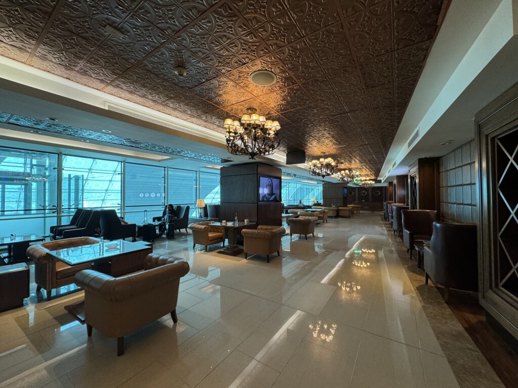 a room with couches and chandeliers