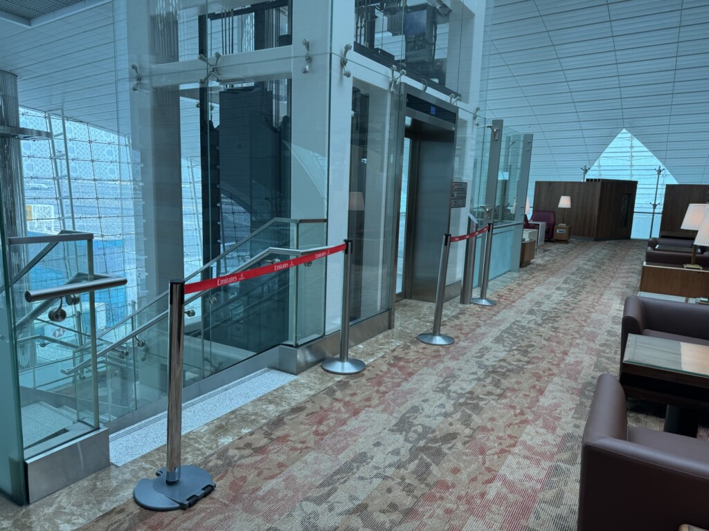 a red rope around a glass wall