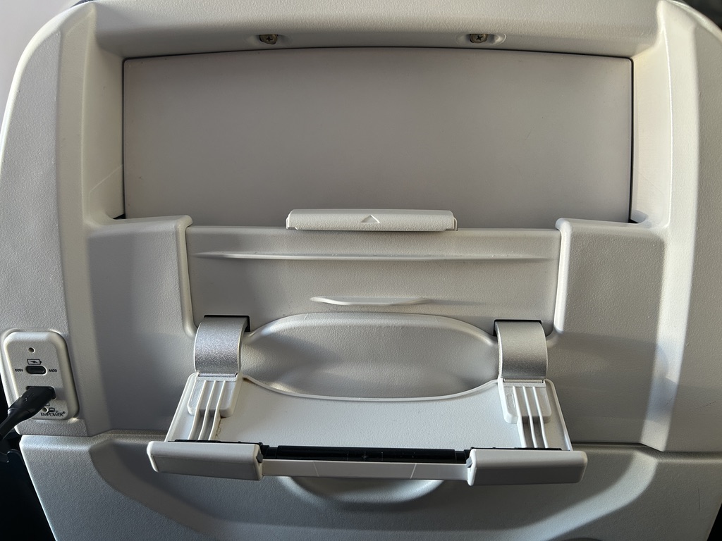a white plastic object with a plastic lid