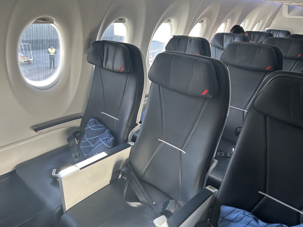 seats in an airplane with windows
