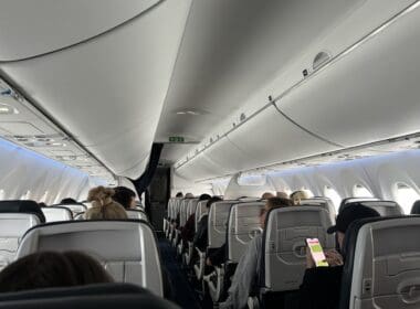 a group of people sitting in an airplane
