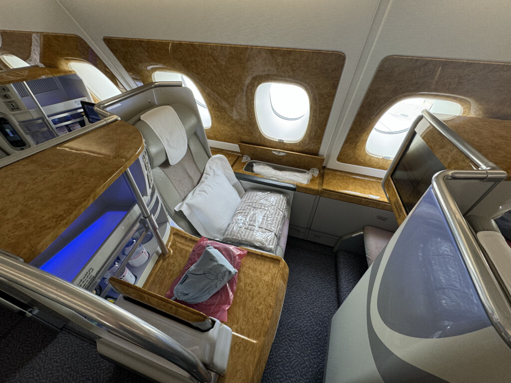 an airplane with a bed and a tv