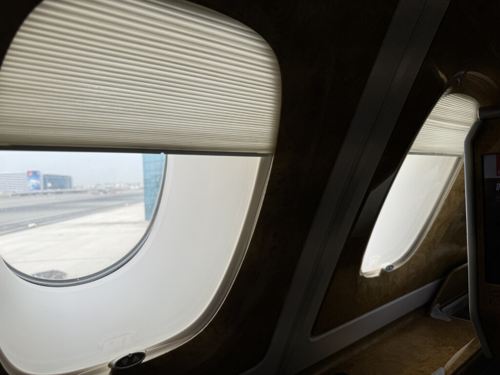 a window with blinds on the side