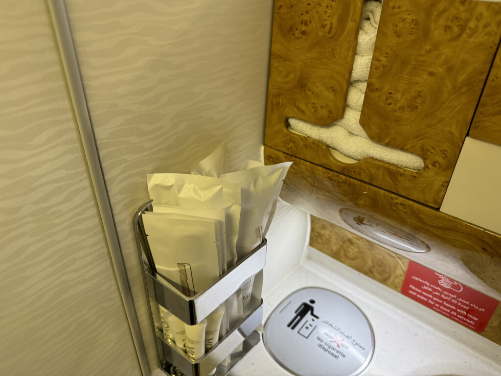 a toilet paper holder with a tissue holder and a tissue box