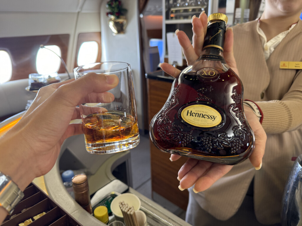 a person holding a bottle of alcohol
