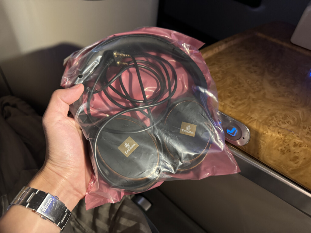 a hand holding a plastic bag with wires