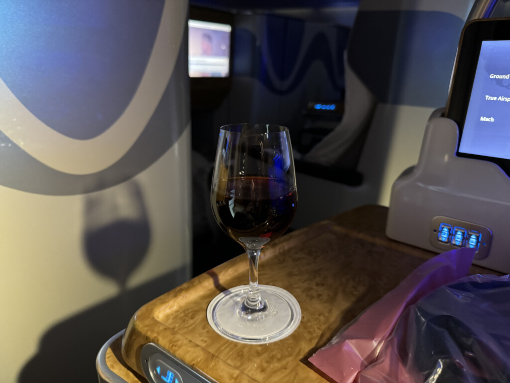 a glass of wine on a tray