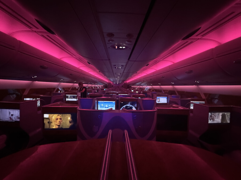 inside a plane with pink lights