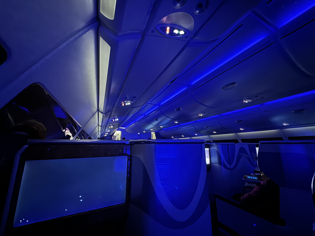 inside an airplane with blue lights
