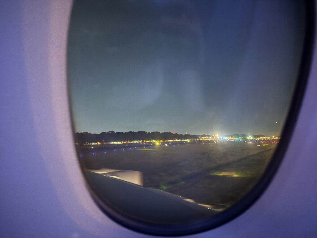 a view of a runway from an airplane window