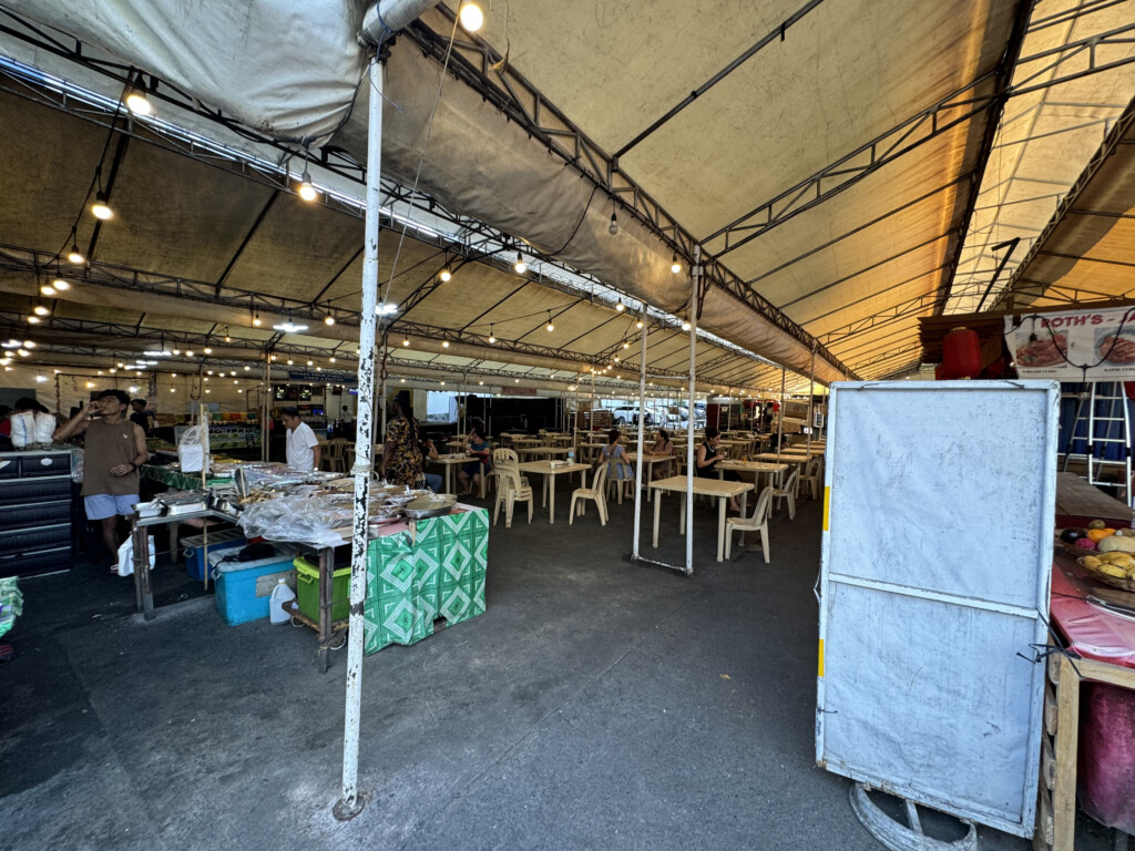 a large tent with tables and chairs