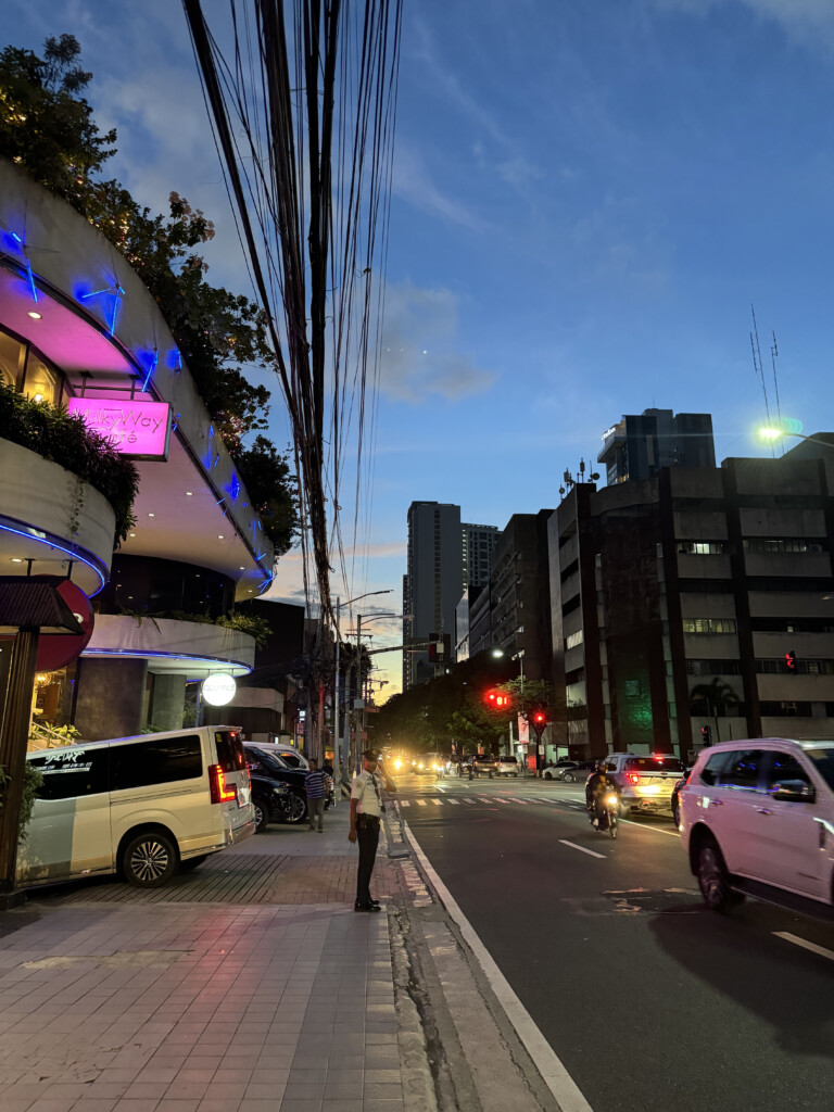 a street with cars and buildings