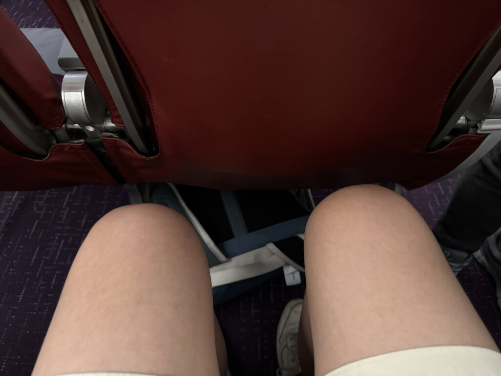 a person's legs in a seat