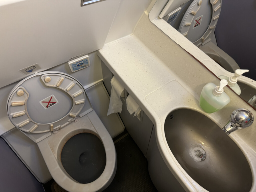 a toilet and sink in a bathroom