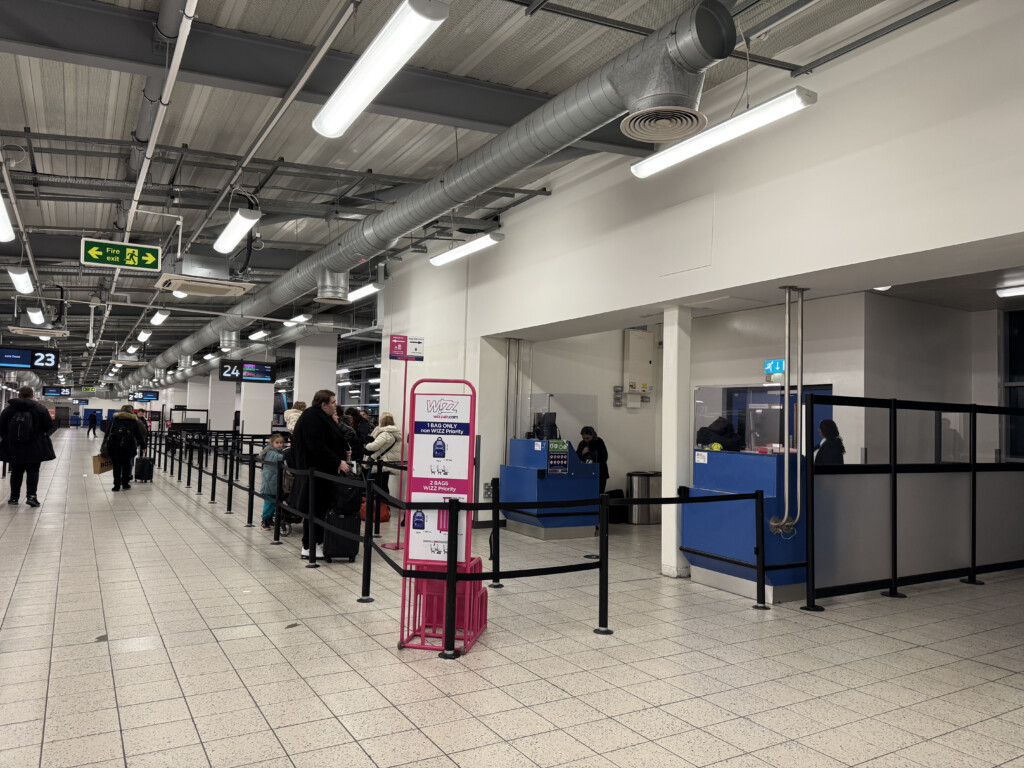 people standing in line at an airport