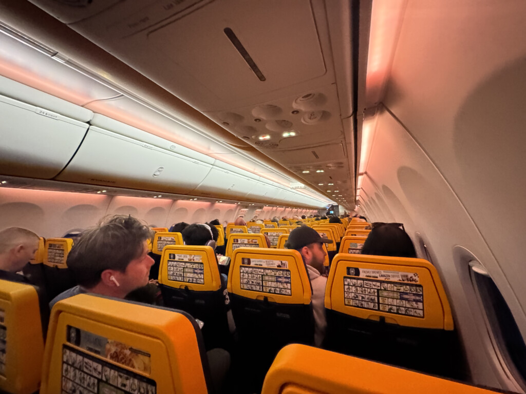a group of people sitting in an airplane