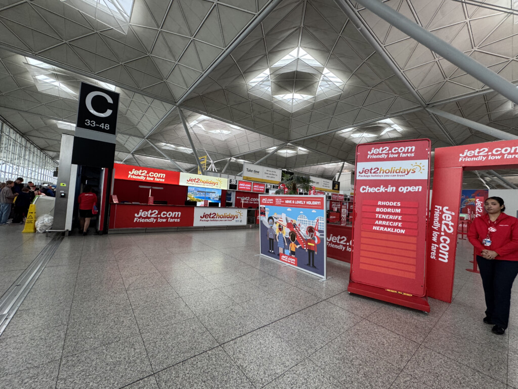 a large airport with signs and advertisements