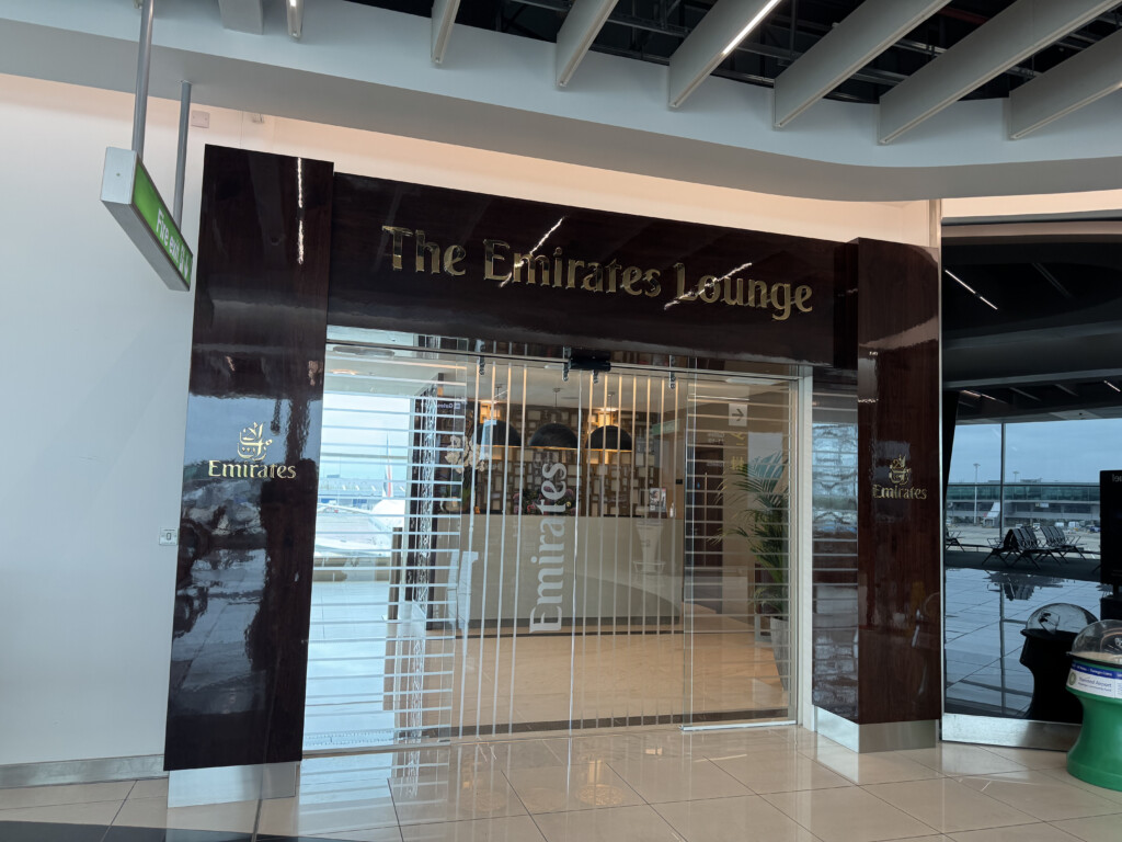 a glass door with gold text on it
