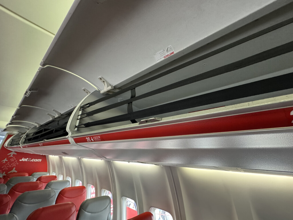 a plane with seats and a shelf