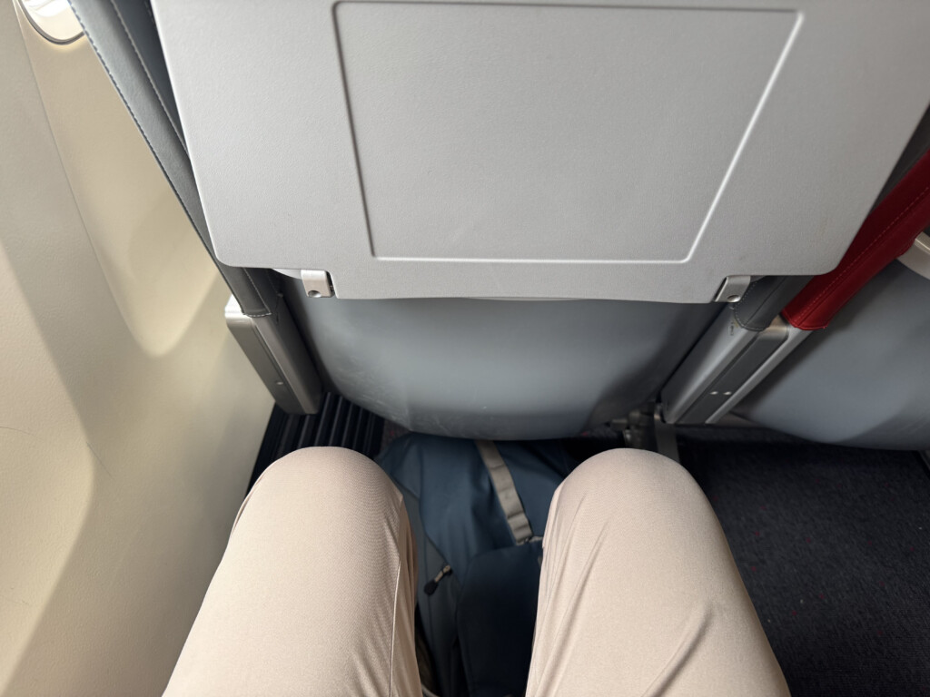 a person's legs in a seat