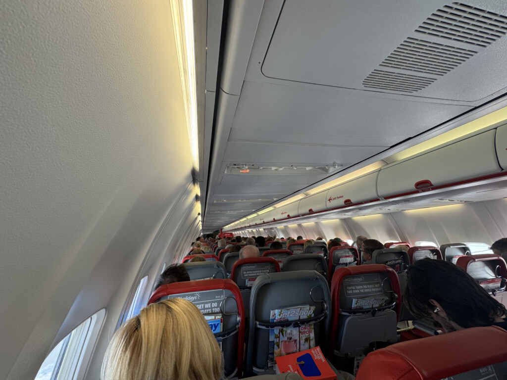 a group of people sitting in an airplane