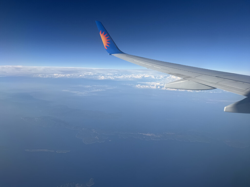 an airplane wing in the sky