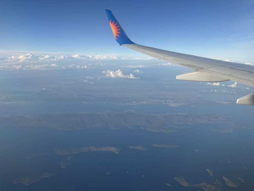 an airplane wing above land