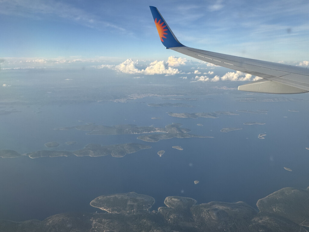 an airplane wing above land
