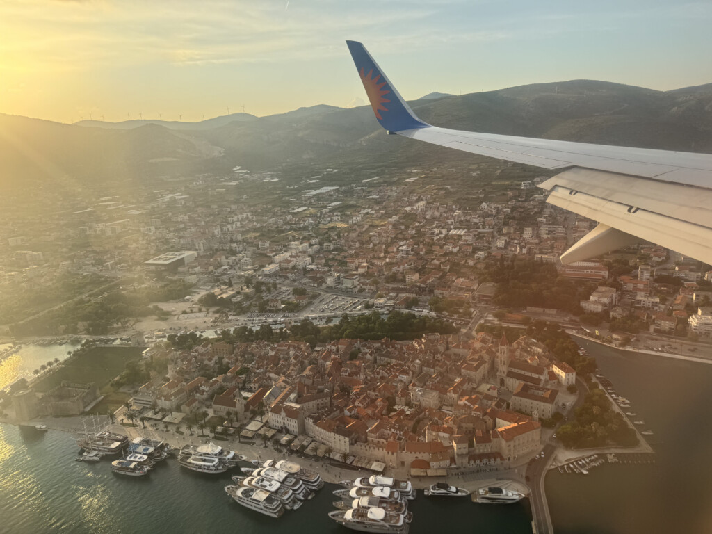 an airplane wing over a city