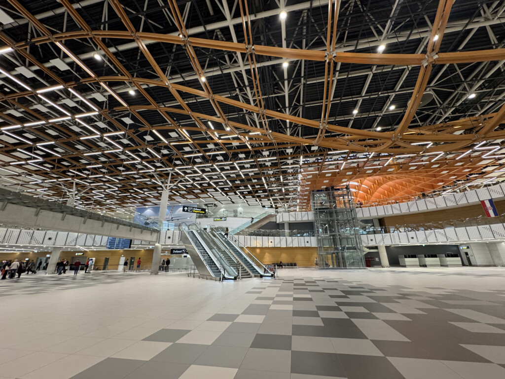 an empty airport with escalators
