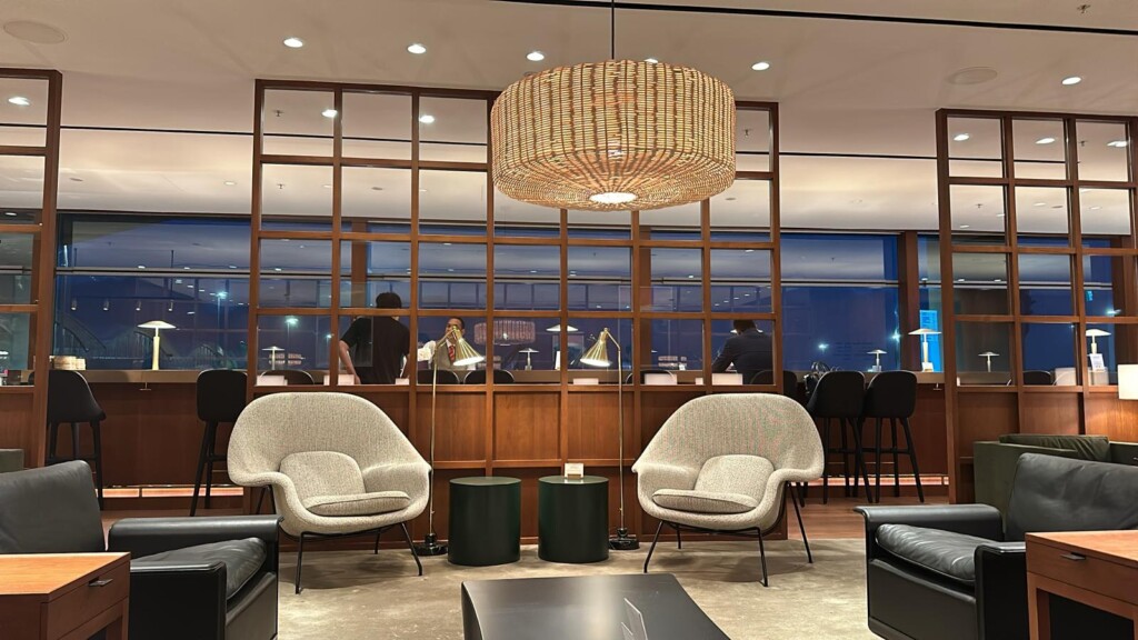 a room with chairs and a chandelier