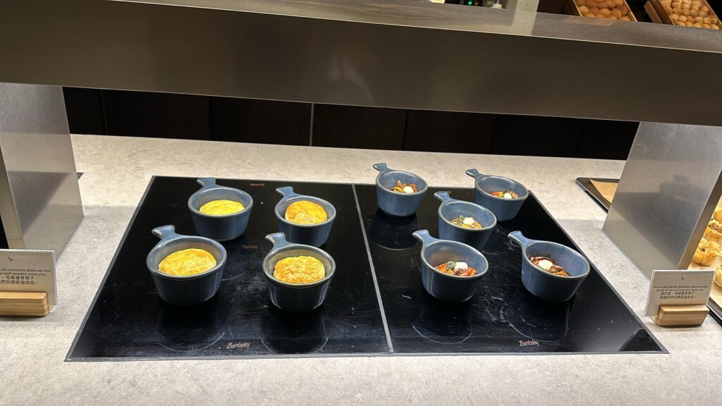 a group of small blue dishes on a black surface