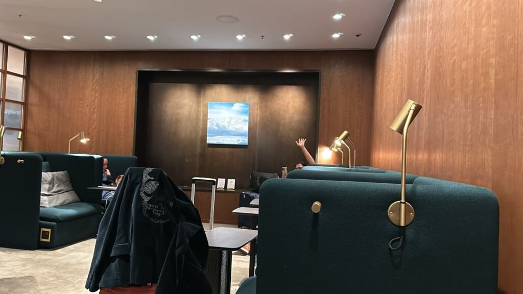 a room with a wall and a lamp