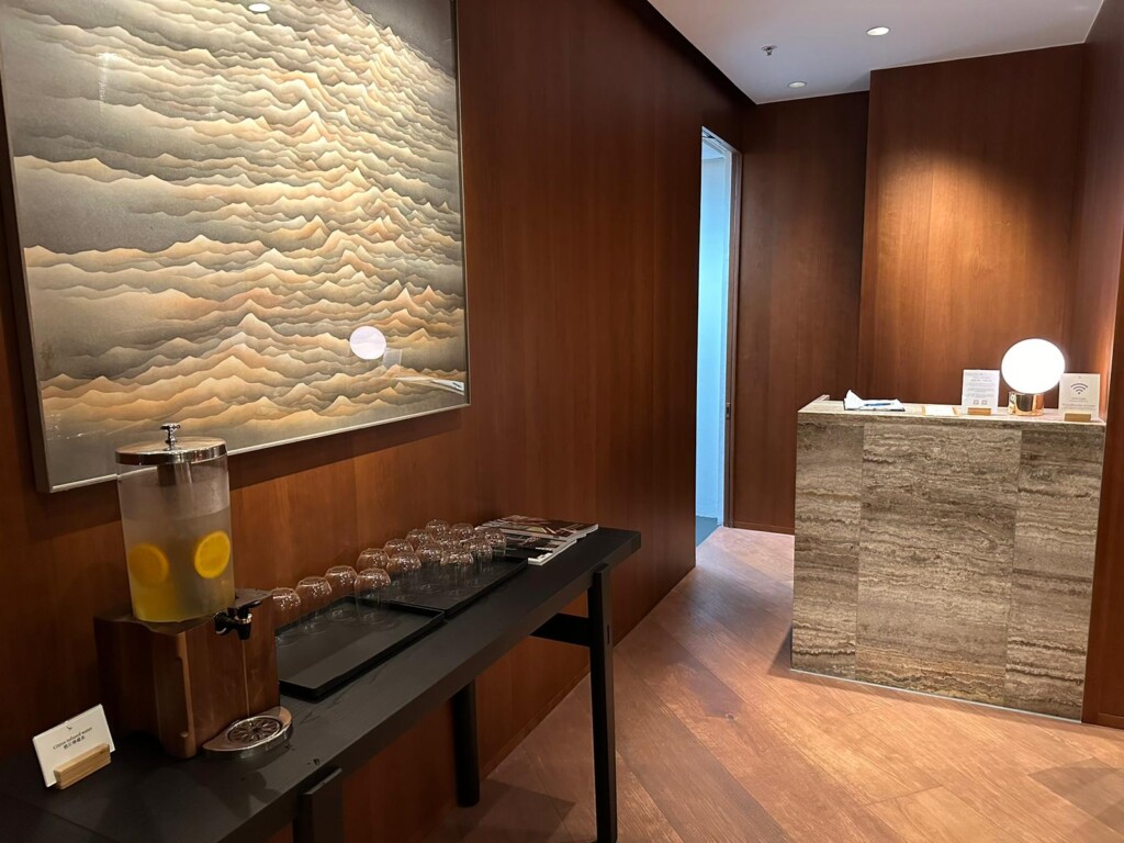 a room with a table and a painting on the wall