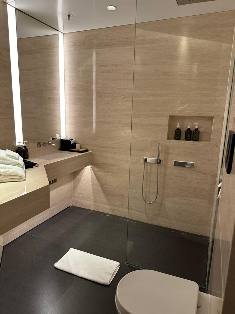 a bathroom with a shower and a sink