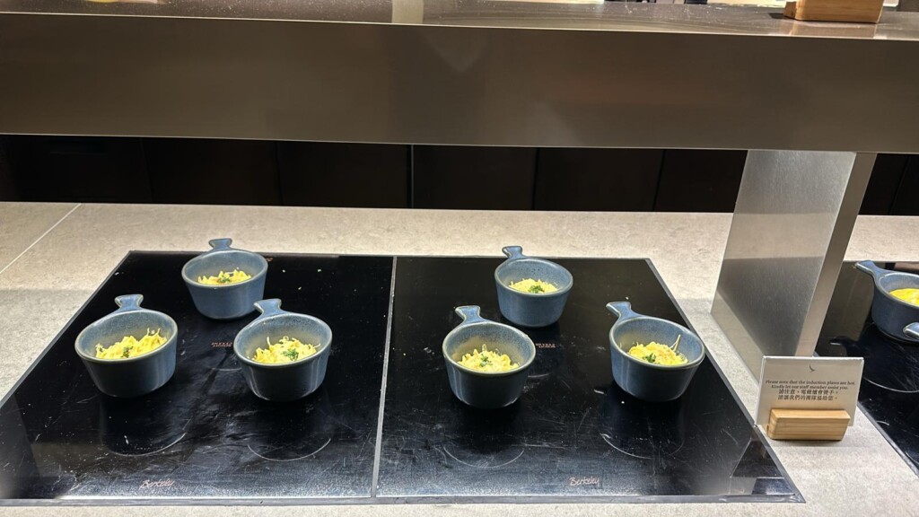 a group of bowls of food on a stove
