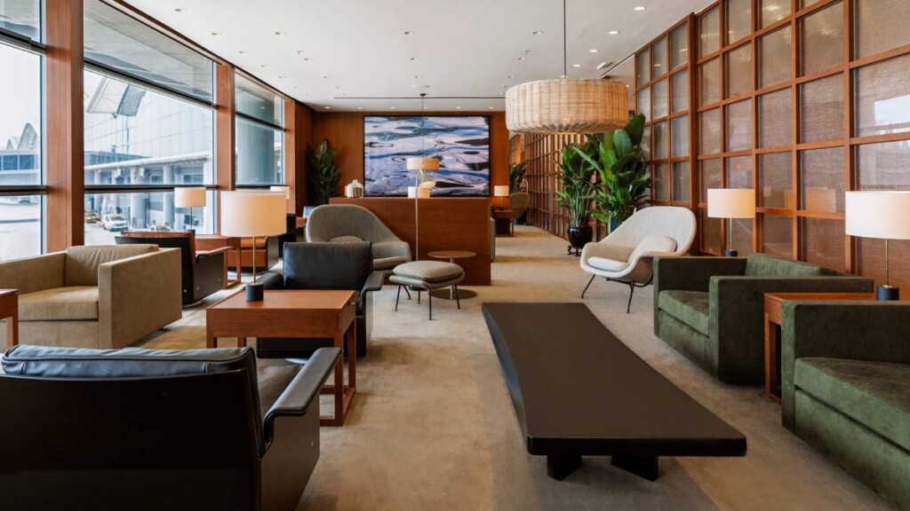 a room with a couch and chairs