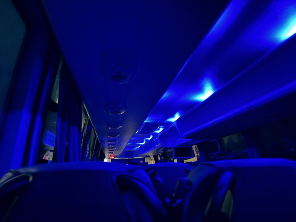 inside a bus with blue lights