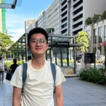 a man wearing glasses and a backpack