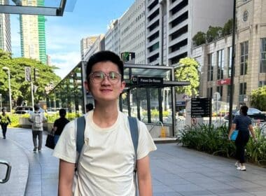 a man wearing glasses and a backpack