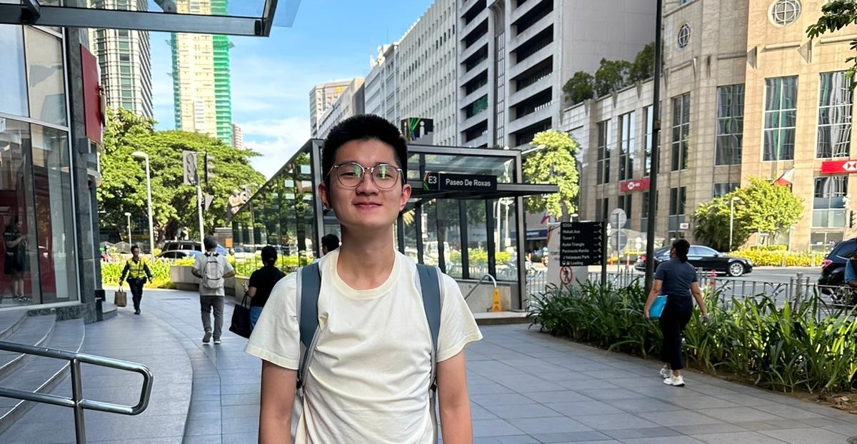 a man wearing glasses and a backpack