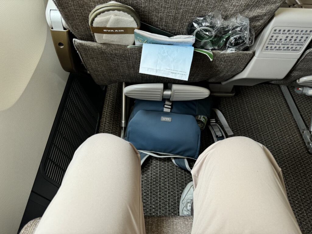 a person's legs in the back of an airplane