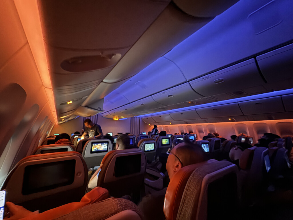 a group of people sitting in an airplane
