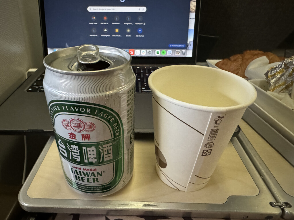 a can and cup on a tray