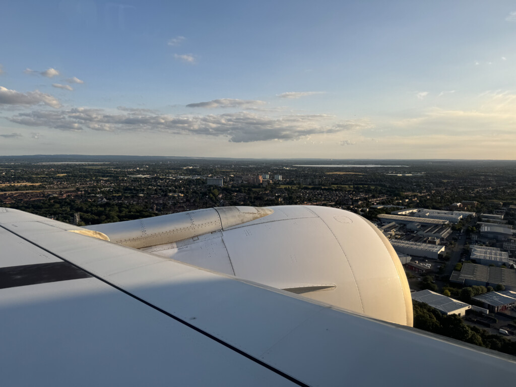an airplane wing and a city