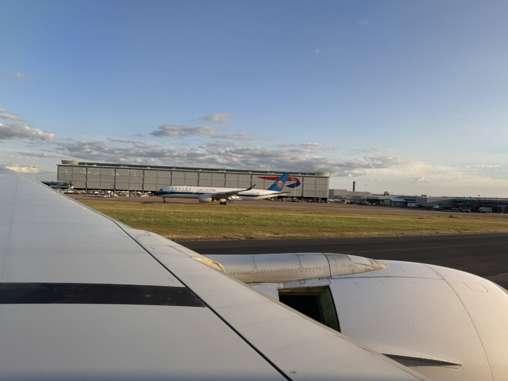 an airplane wing and wing of an airplane on a runway