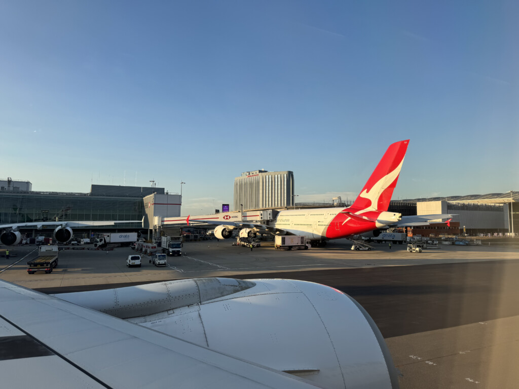 an airport with airplanes and buildings