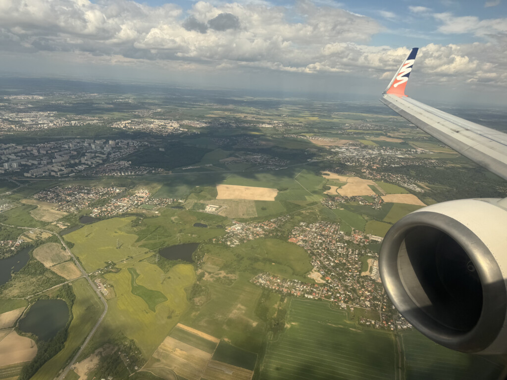 an airplane wing and a landscape